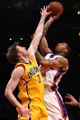 NEW YORK - FEBRUARY 23:  Wilson Chandler #21 of the New York Knicks goes up for a shot against Troy Murphy #3 of the Indiana Pacers at Madison Square Garden February 23, 2009 in New York City. NOTE TO USER: User expressly acknowledges and agrees that, by 
