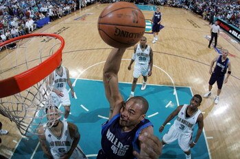 NEW ORLEANS - APRIL 22:  Devean George #40 of the Dallas Mavericks dunks the ball over Tyson Chandler #6 of the New Orleans Hornets in Game One of the Western Conference Quarterfinals during the 2008 NBA Playoffs at The New Orleans Arena on April 22, 2008