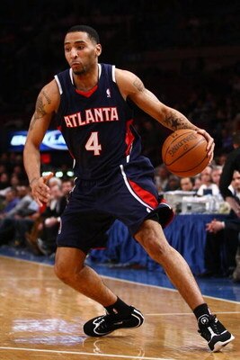 NEW YORK - MARCH 04:  Acie Law #4 of the Atlanta Hawks drives to the basket during the game against the New York Knicks at Madison Square Garden March 4, 2009 in New York City. NOTE TO USER: User expressly acknowledges and agrees that, by downloading and/