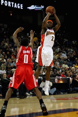 OAKLAND, CA - DECEMBER 12:  Anthony Morrow #22 of the Golden State Warriors goes up for a shoto ver Aaron Brooks #0 of the Houston Rockets during the game on December 12, 2008 at Oracle Arena in Oakland, California.  The Rockets won 119-108.  NOTE TO USER