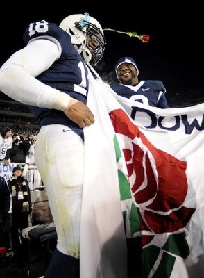 STATE COLLEGE, PA - NOVEMBER 22:  Navorro Bowman #18 and Derrick Williams #2 of the Penn State Nittany Lions raise a Rose Bowl banner after clinching the Big Ten title and advancing to the Rose Bowl after the game against the Michigan State Spartans on No