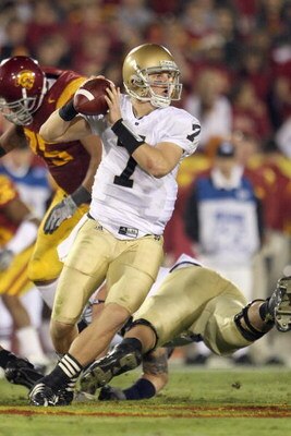 LOS ANGELES - NOVEMBER 29:  Quarterback Jimmy Clausen #7 of the Notre Dame Fighting Irish looks to pass the ball during the game against the USC Trojans at the Memorial Coliseum on November 29, 2008 in Los Angeles, California. (Photo by: Jeff Gross/Getty 