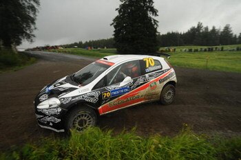 JYVASKYLA, FINLAND - AUGUST 01:  Kimi Raikkonen of Finland and Kaj Lindstrom of Finland compete in their Fiat Grande Punto S2000 during Leg 2 of the WRC Neste Oil Rally of Finland on August  01, 2009  in Jyvaskyla, Finland  (Photo by Massimo Bettiol/Getty