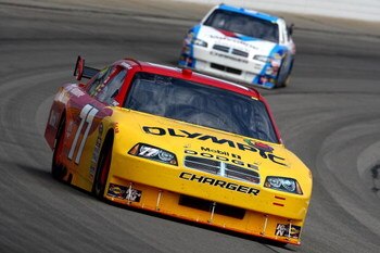 LONG POND, PA - AUGUST 01: Sam Hornish Jr. drives the #77 Olympic Dodge ahead of AJ Allmendinger, driver of the #44 Valvoline Dodge, during practice for the NASCAR Sprint Cup Series Sunoco Red Cross Pennsylvania 500 at the Pocono Raceway on August 1, 2009