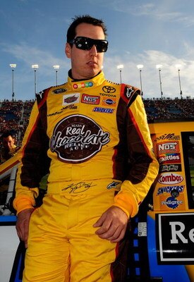 JOLIET, IL - JULY 11:  Kyle Busch, driver of the #18 M&M's Toyota, stands on the grid prior to the start of the NASCAR Sprint Cup Series LifeLock.com 400 at Chicagoland Speedway on July 11, 2009 in Joliet, Illinois.  (Photo by Rusty Jarrett/Getty Images f