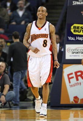 OAKLAND, CA - MARCH 30:  Monta Ellis #8 of the Golden State Warriors looks on against the Memphis Grizzlies during an NBA game on March 30, 2009 at Oracle Arena in Oakland, California. NOTE TO USER: User expressly acknowledges and agrees that, by download