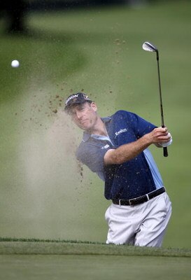 GRAND BLANC, MI - JULY 30:  Jim Furyk hits from a green side bunker on the first hole during the first round of the Buick Open at Warwick Hills Golf and Country Club on July 30, 2009 in Grand Blanc, Michigan.  (Photo by Gregory Shamus/Getty Images)