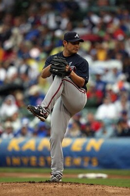 CHICAGO - JULY 8:  Kenshin Kawakami #11 of the Atlanta Braves pitches against the Chicago Cubs during the game on July 8, 2009 at Wrigley Field in Chicago, Illinois. (Photo by Jonathan Daniel/Getty Images) 