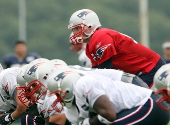 FOXBORO, MA - JULY 31:  Quarterback Tom Brady #12 of the New England Patriots lines up during training camp on July 31, 2009 at Gillette Stadium in Foxboro, Massachusetts.  (Photo by Elsa/Getty Images)