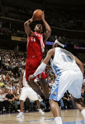 DENVER - APRIL 17:  Chuck Hayes #44 of Houston Rockets shoots over Carmelo Anthony #13 of the Denver Nuggets on April 17, 2006 at the Pepsi Center in Denver, Colorado.  The Rockets won 86-83.  NOTE TO USER: USER expressly acknowledges and agrees that, by 
