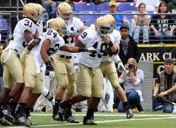 BALTIMORE - NOVEMBER 15:  Toryan Smith #49 of the Notre Dame Fighting Irish celebrates his first quarter touchdown with his teammates after he returned a blocked punt against the Navy Midshipmen on November 15, 2008 at M&T Bank Stadium in Baltimore, Maryl
