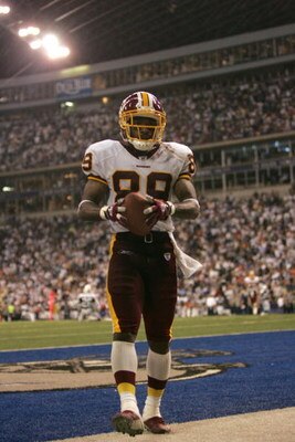 IRVING, TX - SEPTEMBER 19:  Santana Moss #89 of the Washington Redskins stands in the back of the endzone after scoring a touchdown against the Dallas Cowboys on September 19, 2005 at Texas Stadium in Irving, Texas. The Redskins won 14-13. (Photo by Ronal