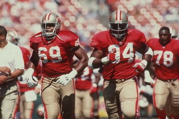 17 Sep 1995:  Offensive lineman Ron Milstead #69 of the San Francisco 49ers jogs onto the field with defensive lineman #94 Dana Stubblefield and the rest of the team during pre-game warm ups before the 49ers 28-3 victory over the New England Patriots at3C