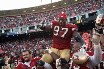 SAN FRANCISCO - DECEMBER 23: Bryant Young #97 of the San Francisco 49ers is carried off the field by teammates after his last career home game against the Tampa Bay Buccaneers during an NFL game at Monster Park December 23, 2007 in San Francisco, Californ