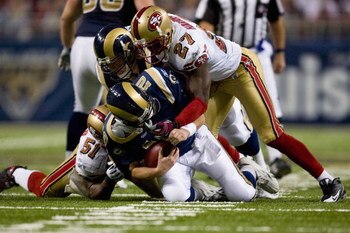 ST. LOUIS, MO - DECEMBER 21: Marc Bulger #10 of the St. Louis Rams is sacked by Walt Harris #27 of the San Francisco 49ers at the Edward Jones Dome on December 21, 2008 in St. Louis, Missouri.  The 49ers beat the Rams 17-16.  (Photo by Dilip Vishwanat/Get