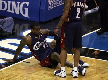 ORLANDO, FL - MAY 30: LeBron James #23 of the Cleveland Cavaliers sits on the court after being fouled by the Orlando Magic in Game Six of the Eastern Conference Finals during the 2009 Playoffs at Amway Arena on May 30, 2009 in Orlando, Florida. NOTE TO U