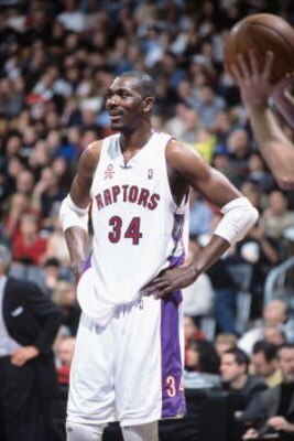 25 Nov 2001: Hakeem Olajuwon #34 of the Toronto Raptors waits on the court durng the game against the Philadelphia 76ers at Air Canada Centre in Toronto, Canada. The Raptors defeated the 76ers 107-88. TO USER: User expressly acknowledges and agrees that, 