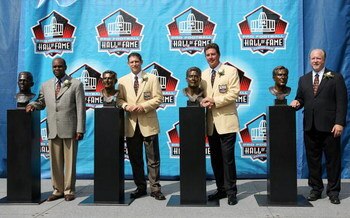 CANTON, OH - AUGUST 7: Pro Football Hall of Fame enshrinees and family members, (L-R) Dr. Steven Towns, grandson of enshrinee Fritz Pollardm, Steve Young of the San Francisco 49ers, Dan Marino of the Miami Dolphins and David Friedman, nephew of enshrinee 