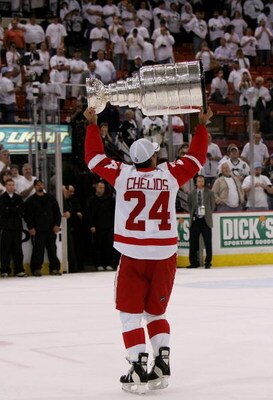 PITTSBURGH - JUNE 04: Chris Chelios #24 of the Detroit Red Wings celebrates with the Stanley Cup after defeating the Pittsburgh Penguins in game six of the 2008 NHL Stanley Cup Finals at Mellon Arena on June 4, 2008 in Pittsburgh. Pennsylvania. The Red Wi