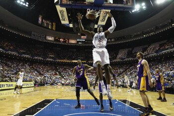 ORLANDO, FL - JUNE 11:  Dwight Howard #12 of the Orlando Magic dunks against the Los Angeles Lakers in Game Four of the 2009 NBA Finals on June 11, 2009 at Amway Arena in Orlando, Florida. The Lakers won in overtime 99-91. NOTE TO USER:  User expressly ac