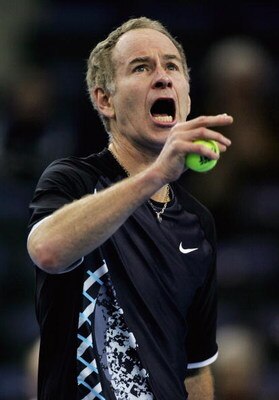 BELFAST, UNITED KINGDOM - FEBRUARY 23:  John McEnroe of the United States shows his frustration as a spectator makes a noise during his game against Jeremy Bates of England during the third day of the BlackRock Tour of Champions at the Odyssey Arena on Fe