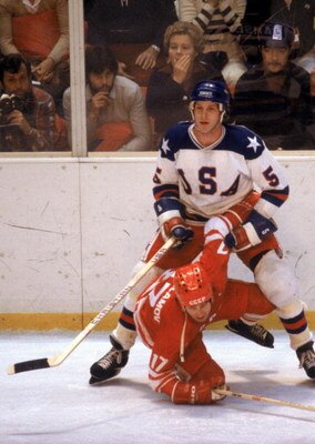 LAKE PLACID, NY - FEBRUARY 22:  Mike Ramsey #5 of the United States stands over Valeri Kharlamov #17 of the Soviet Union during the Winter Olympic Games on February 22, 1980 in Lake Placid, New York. The United States won 4-3.  (Photo by Tony Duffy/Getty 