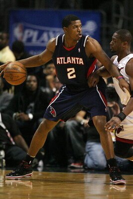 MIAMI - APRIL 27:  Joe Johnson #2 of the Atlanta Hawks backs down Dwyane Wade #3 of the Miami Heat during Game Four of the Eastern Conference Quarterfinals of the NBA Playoffs at American Airlines Arena on April 27, 2009 in Miami, Florida. NOTE TO USER: U