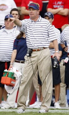 TUCSON, AZ - OCTOBER 04:  Head coach Mike Stoops of the Arizona Wildcats points from the sideline during the second quarter while playing the Washington Huskies October 4, 2008 at Arizona Stadium in Tucson, Arizona. Arizona won the game 48-14.  (Photo by 