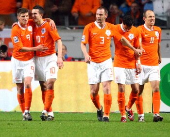 AMSTERDAM, NETHERLANDS - MARCH 28: Klaas-Jan Huntelaar of Netherlands (L) celebrates the second goal with Robin van Persie  (2nd L) c during the FIFA 2010 World Cup qualifying match between Netherlands and Scotland at the Arena on March 28, 2009 in Amster
