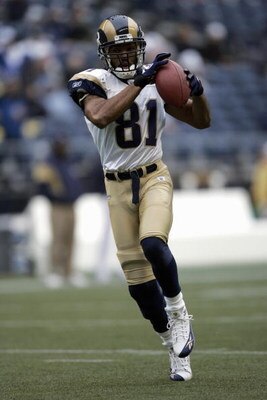SEATTLE - NOVEMBER 13:  Torry Holt #81 of the St. Louis Rams makes a catch during the game with the Seattle Seahawks at Qwest Field on November 13, 2005 in Seattle, Washington.  The Seahawks won 31-16. (Photo by Otto Greule Jr/Getty Images) 