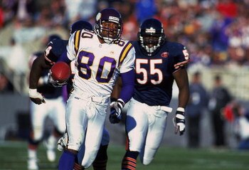 14 Nov 1999: Cris Carter #80 of the Minnesota Vikings carries the ball as he is chased by Sean Harris #55 of the Chicago Bears at the Soldier Field in Chicago, Illinois. The Vikings defeated the Bears 27-24 in overtime. Mandatory Credit: Jonathan Daniel  