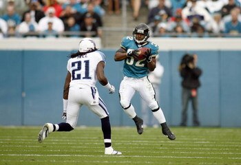 JACKSONVILLE, FL - NOVEMBER 05: Maurice Jones -Drew #32 of the Jacksonville Jaguars makes a catch during the game against Reynaldo Hill #21 of the Tennessee Titans on November 5, 2006 at Alltel Stadium in Jacksonville, Florida. (Photo by Marc Serota/Getty