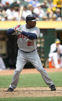 OAKLAND, CA - JUNE 11: Delmon Young #21 of the Minnesota Twins bats against the Oakland Athletics during a Major League Baseball game on June 11, 2009 at the Oakland Coliseum in Oakland, California.  (Photo by Jed Jacobsohn/Getty Images)