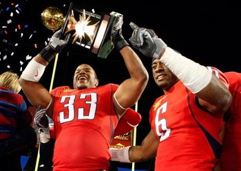 LAS VEGAS - DECEMBER 20:  Ronnie Palmer #33 and Devin Ross #6 of the Arizona Wildcats celebrate after the team's 31-21 victory over the Brigham Young University Cougars in the Pioneer Las Vegas Bowl at Sam Boyd Stadium December 20, 2008 in Las Vegas, Neva