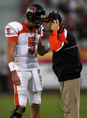 LOS ANGELES - NOVEMBER 3:  Head coach Mike Riley talks with quarterback Sean Canfield #5 of the Oregon State Beavers in the game against the USC Trojans on November 3, 2007 at the Los Angeles Coliseum in Los Angeles, California. USC won 24-3.   (Photo by 