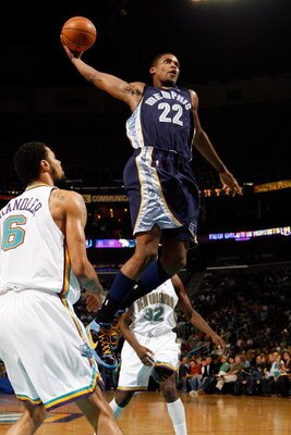 NEW ORLEANS - DECEMBER 07:  Rudy Gay #22 of the Memphis Grizzlies dunks the ball over Tyson Chandler #6 of the New Orleans Hornets on December 7, 2007 at the New Orleans Arena in New Orleans, Louisiana.  NOTE TO USER: User expressly acknowledges and agree