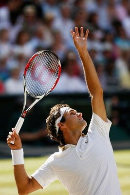 WIMBLEDON, ENGLAND - JULY 05:  Roger Federer of Switzerland serves during the men's singles final match against Andy Roddick of USA on Day Thirteen of the Wimbledon Lawn Tennis Championships at the All England Lawn Tennis and Croquet Club on July 5, 2009 
