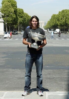 PARIS - JUNE 12:  Spanish tennis star Rafael Nadal poses with his trophy in the Place de la Concorde on June 12, 2006 in Paris, France. Nadal won the French Open final. beating Roger Federer at Roland Garros 1-6, 6-1, 6-4, 7-6.  (Photo by Francois Durand/