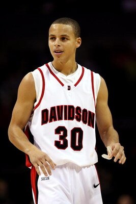 CHARLOTTE, NC - DECEMBER 06:  Stephen Curry #30 of the Davidson Wildcats watches on during their game against the North Carolina State Wolfpack at Time Warner Cable Arena on December 6, 2008 in Charlotte, North Carolina.  (Photo by Streeter Lecka/Getty Im