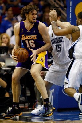 ORLANDO, FL - JUNE 11:  Pau Gasol #16 of the Los Angeles Lakers goes up against Hedo Turkoglu #15 and Jameer Nelson #14 of the Orlando Magic in Game Four of the 2009 NBA Finals on June 11, 2009 at Amway Arena in Orlando, Florida.  NOTE TO USER:  User expr