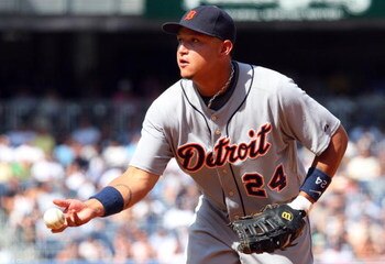 NEW YORK - JULY 19:  Miguel Cabrera #24 of the Detroit Tigers flips the ball to first base for an out against the New York Yankees on July 19, 2009 at Yankee Stadium in the Bronx borough of New York City.  (Photo by Jim McIsaac/Getty Images)