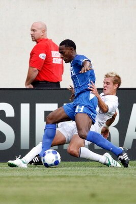 CHICAGO - JULY 23:  Stuart Holden #10 of the USA slide tackles Carlos Palacios #14 of Honduras during their CONCACAF Cup Semifinal match at Soldier Field on July 23, 2009 in Chicago, Illinois.  (Photo by Brian Kersey/Getty Images)