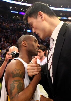 LOS ANGELES, CA - MAY 17:  Kobe Bryant #24 of the Los Angeles Lakers hugs Yao Ming #11 of the Houston Rockets after the Lakers defeated the Rockets 89-70 in Game Seven of the Western Conference Semifinals during the 2009 NBA Playoffs at Staples Center on 
