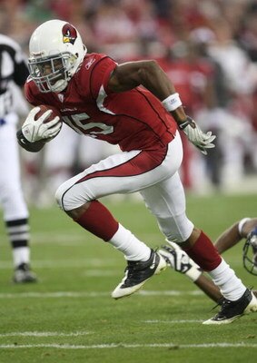 GLENDALE, AZ - DECEMBER 28:  Wide receiver Steve Breaston #15 of the Arizona Cardinals carries on a 14 yard touchdown reception against the Seattle Seahawks on December 28, 2008 at University of Phoenix Stadium in Glendale, Arizona.  The Cardinals won 34-