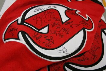 EAST RUTHERFORD, NJ - MAY 8: Signatures from all the members of the 2006-07 New Jersey Devils adorn a jersey which will be auctioned off for charity this summer on May 8, 2007 at the Continental Airlines Arena in East Rutherford, New Jersey. Players met f