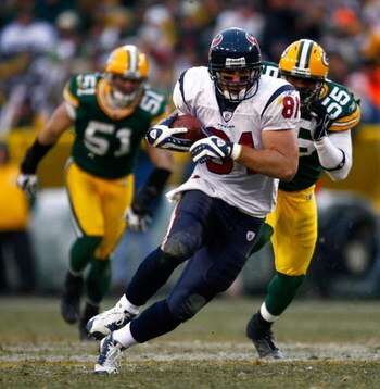 GREEN BAY, WI - DECEMBER 07:  Owen Daniels #81 of the Houston Texans carries the ball while being pursued by Desmond Bishop #55 of the Green Bay Packers during the fourth quarter at Lambeau Field on December 7, 2008 in Green Bay, Wisconsin. The Texans def
