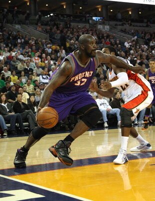 OAKLAND, CA - MARCH 15:  Shaquille O'Neal #32 of the Phoenix Suns dribbles the ball against the Golden State Warriors during an NBA game on March 15, 2009 at Oracle Arena in Oakland, California. NOTE TO USER: User expressly acknowledges and agrees that, b