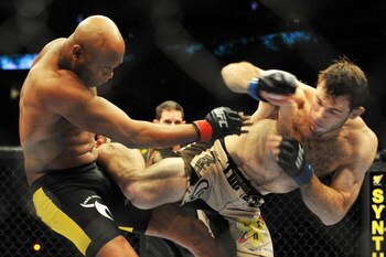 PHILADELPHIA - AUGUST 08:  (L-R) Anderson Silva battles  Forrest Griffin during their light heavyweight bout at UFC 101: Declaration at the Wachovia Center on August 8, 2009 in Philadelphia, Pennsylvania.  (Photo by Jon Kopaloff/Getty Images)