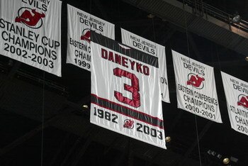 EAST RUTHERFORD, NJ - MARCH 24:  A banner rises to the rafters during a jersey retirement ceremony for Ken Daneyko #3 of the New Jersey Devils before the Devils game against the Boston Bruins on March 24, 2006 at the Continental Airlines Arena in East Rut