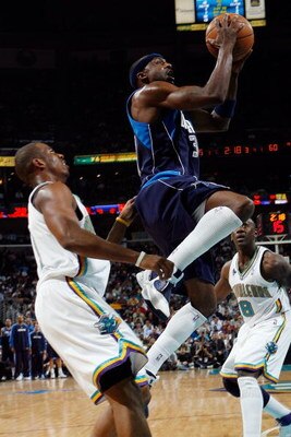 NEW ORLEANS - FEBRUARY 20:  Jason Terry #31 of the Dallas Mavericks makes a shot over Chris Paul #3  of the New Orleans Hornets on February 20, 2008 at the New Orleans Arena in New Orleans, Louisiana.  The Hornets defeated the Mavericks 104-93.  NOTE TO U